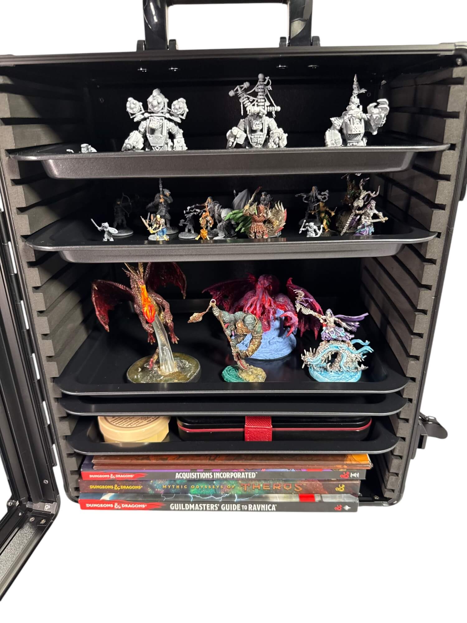 Black display case with shelves holding various figurines and books.