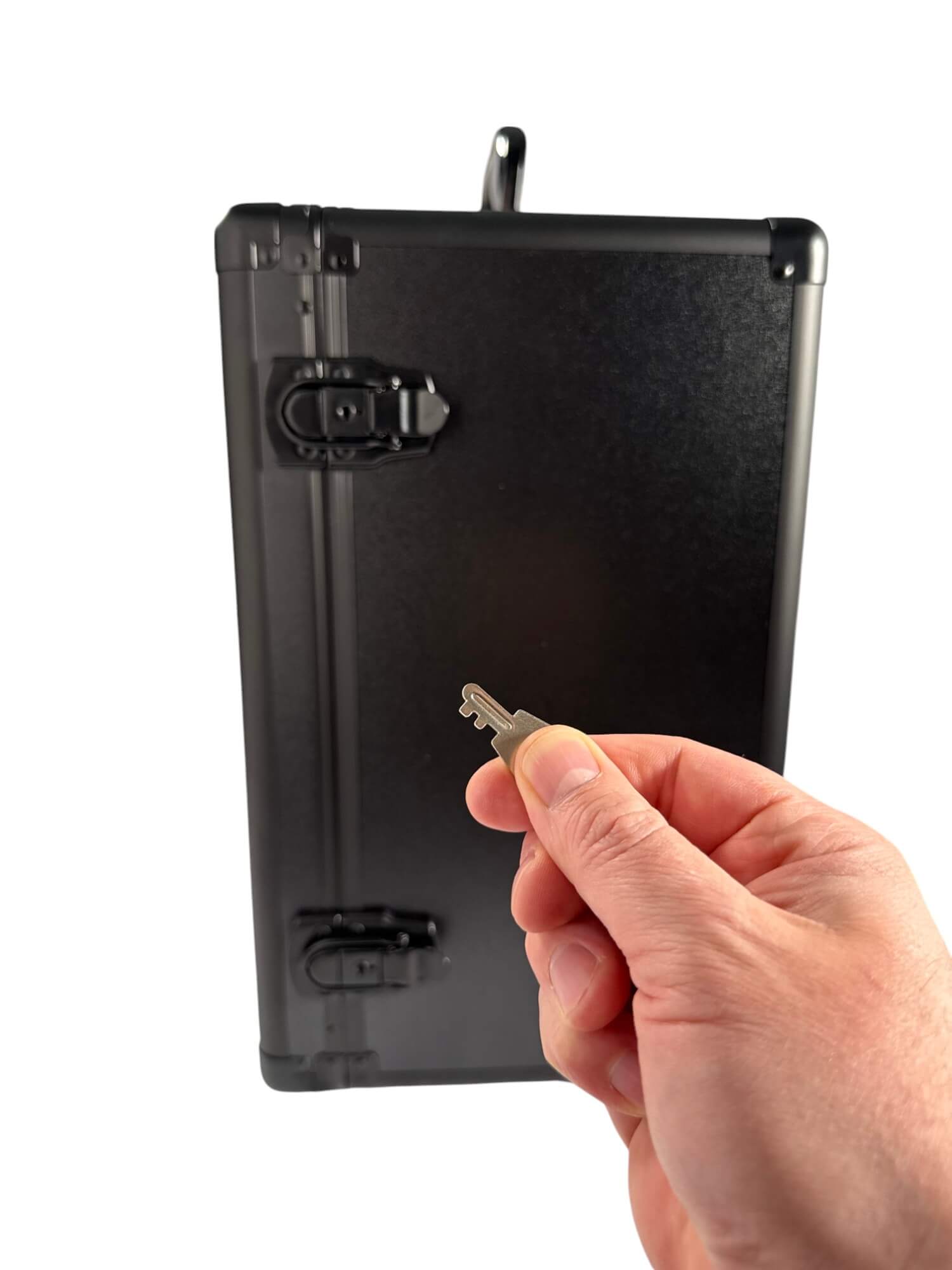 Hand holding a key near case on a white background