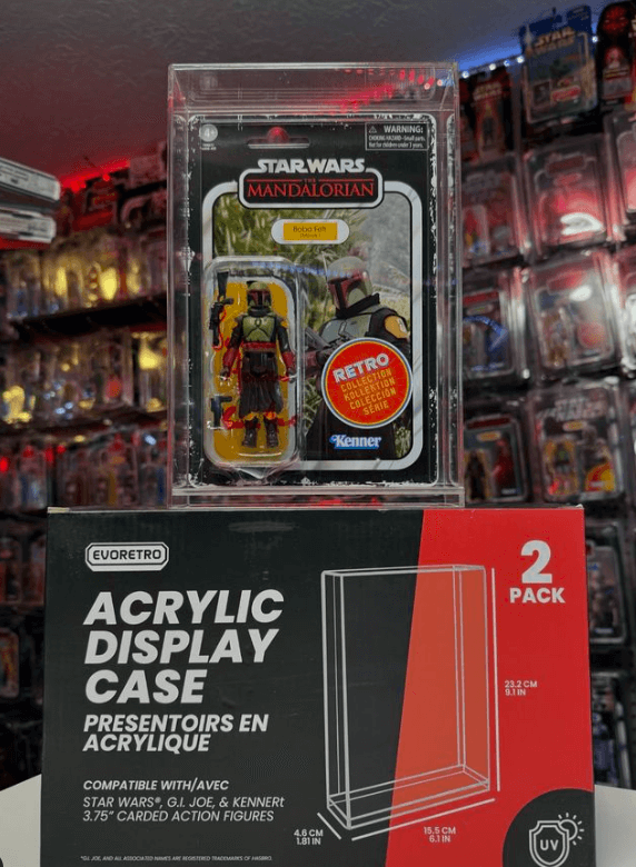 Star Wars action figure in packaging with an acrylic display case