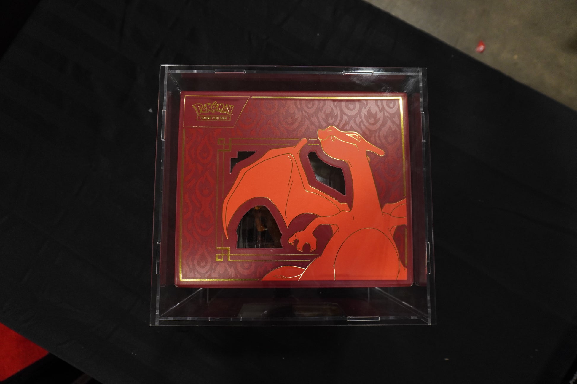 Card with a dragon design on a black surface