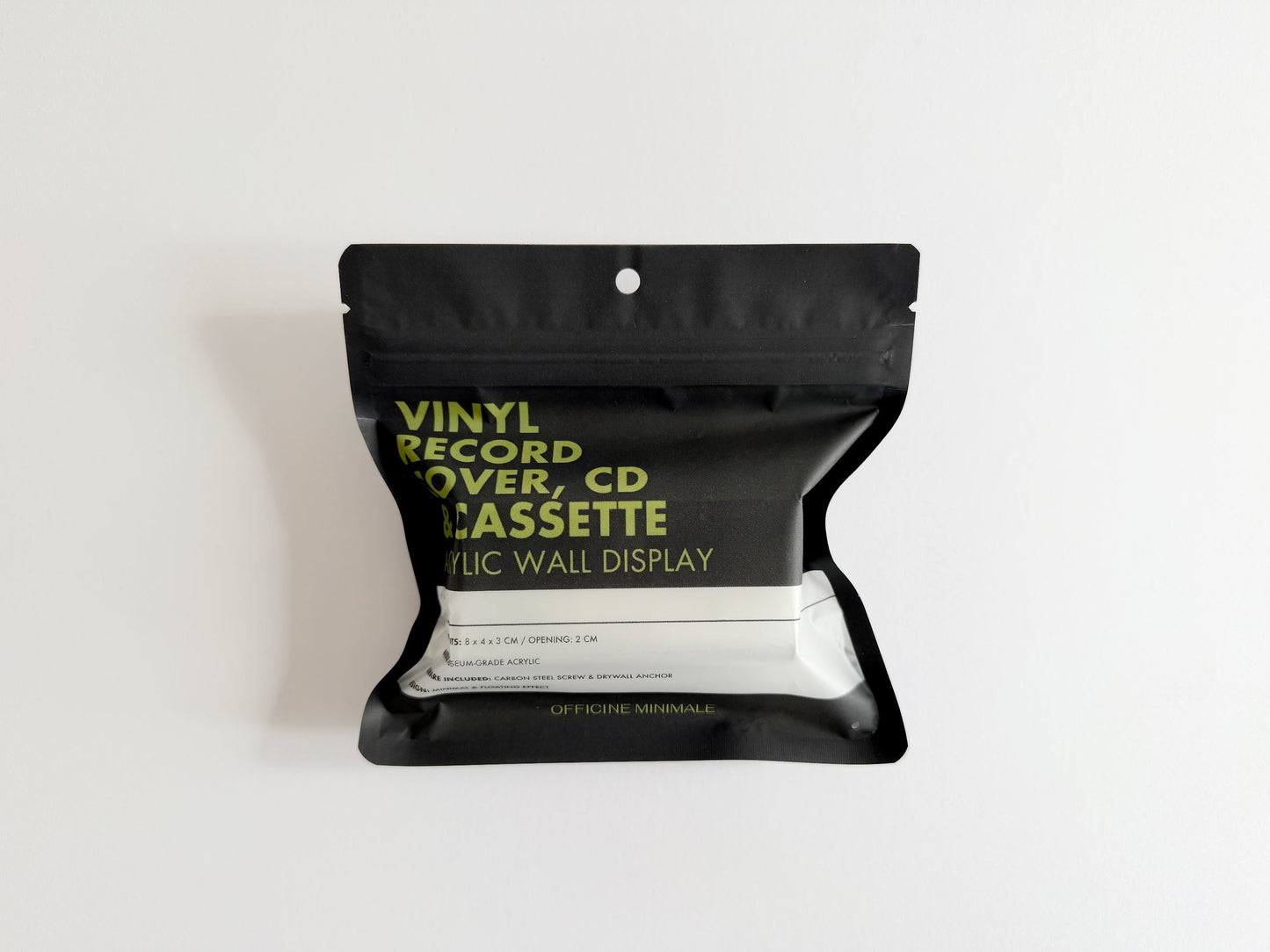 Black packaging with green text on a white background