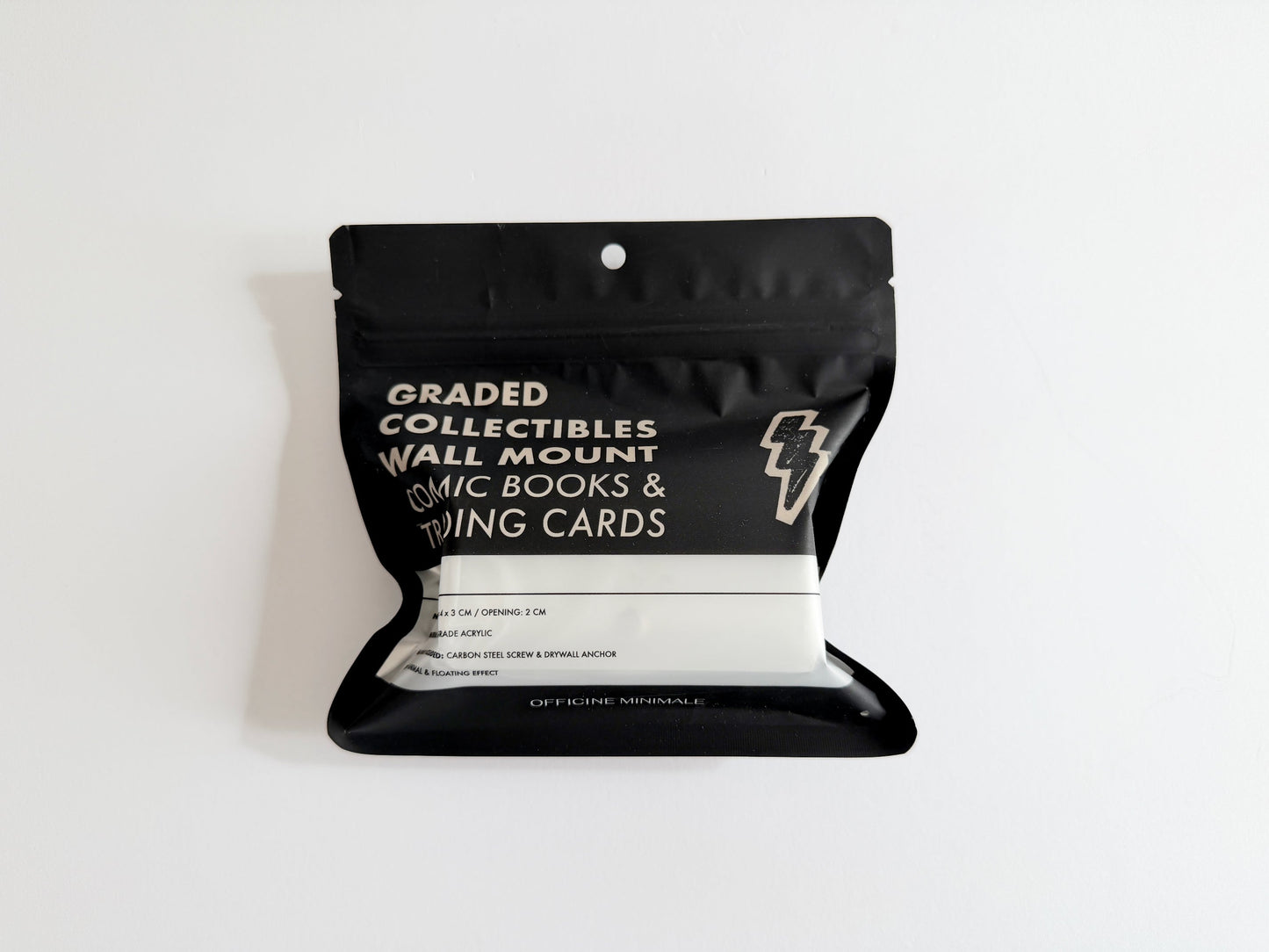 Black packaging for graded collectibles on a white background